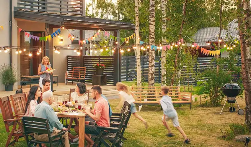 Family dinner in the backyard on a summer day. Find out how to prevent mosquitoes from taking over your backyard in Indiana, Illinois and Kentucky.