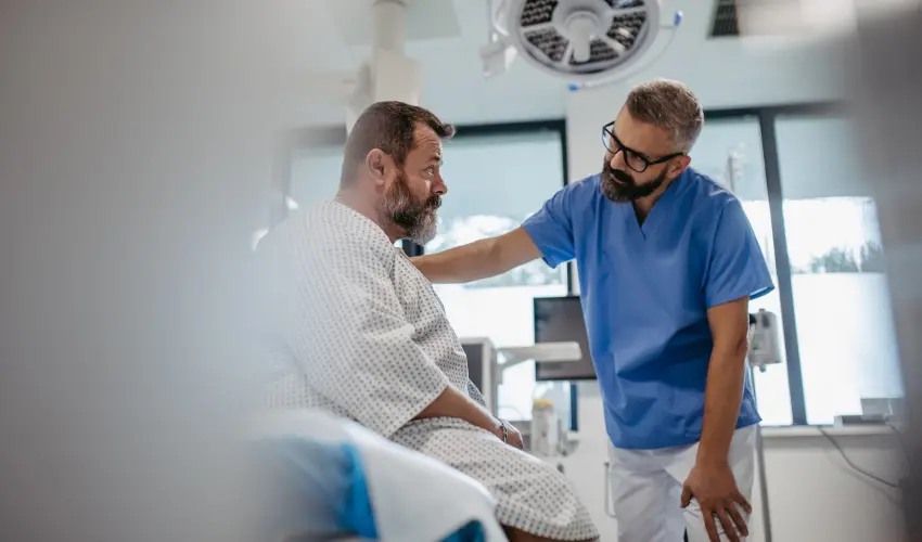 A doctor checks on a patient at the hospital after contracting a mosquito-borne illness.